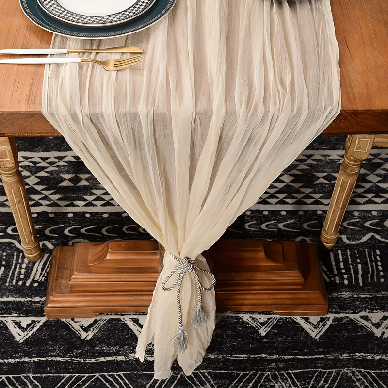 Boho table runner made of pleated polyester gauze, perfect for rustic or wedding decor. Ideal for holiday parties or showers.