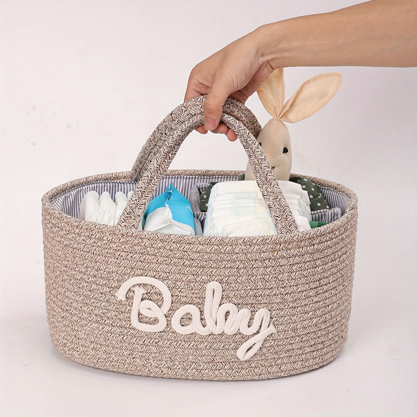 Storage basket made of cotton rope with lettered design, featuring a detachable inner basket for separating dry and wet items. Can be used as a hand-held storage solution.