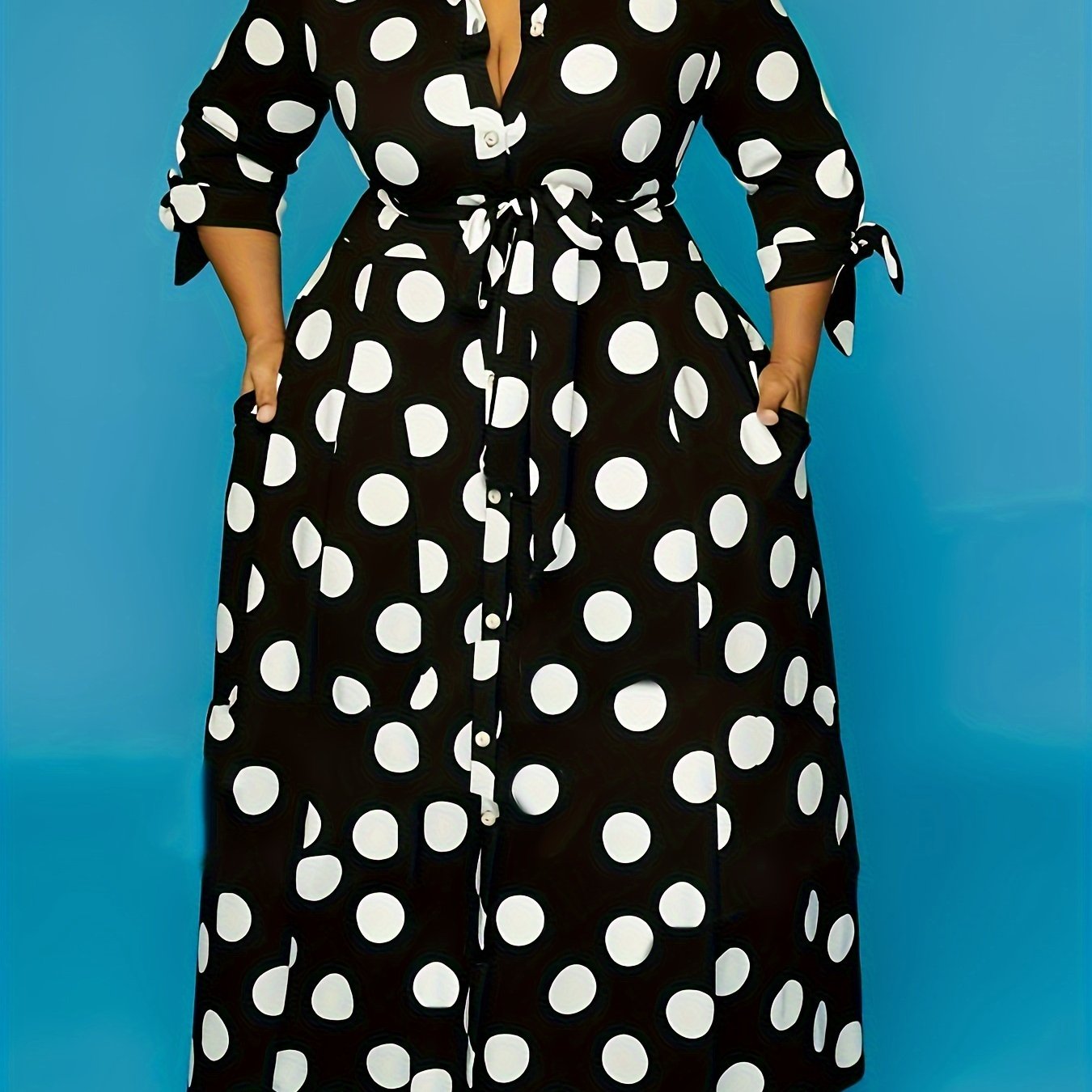 Women's plus size polka dot print maxi dress with collared button-up front and belted waist.