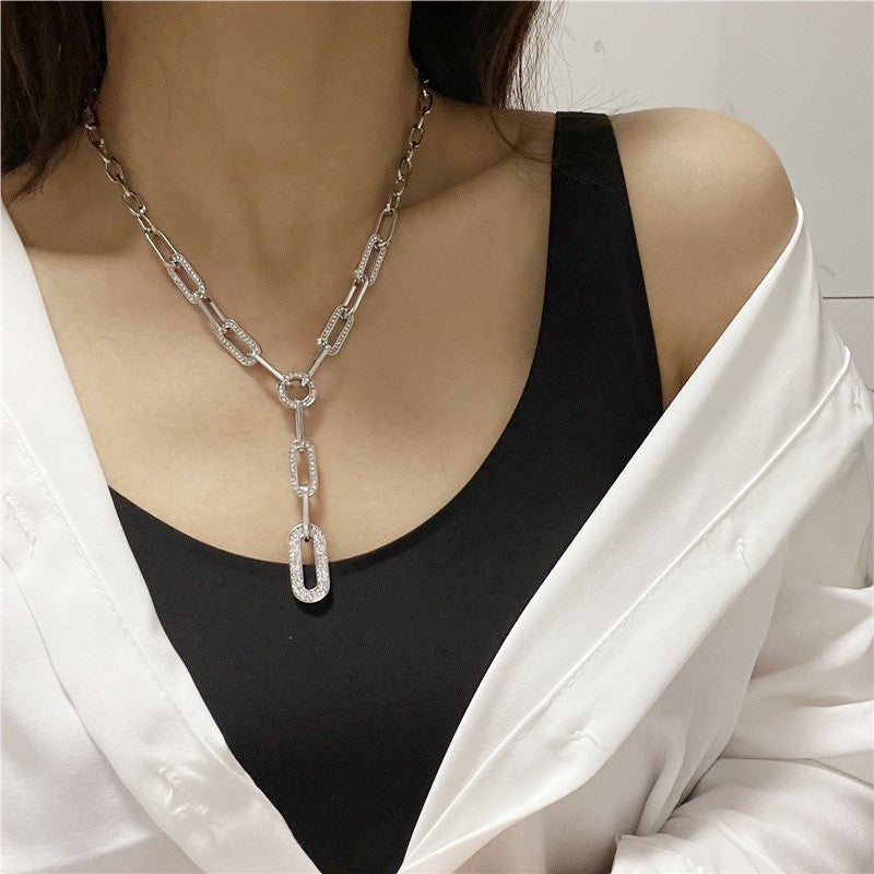 Stylish and minimalist Y-shaped chain necklace for women featuring a sparkling cubic zirconia geometric pendant.