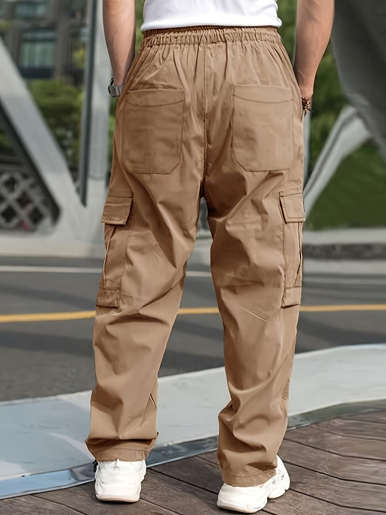 Men's olive green cargo pants with side pockets, adjustable waist, and lightweight twill fabric - perfect for casual street style jogging in all seasons.