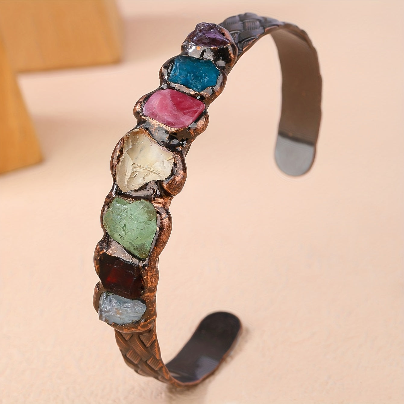 Handmade Bohemian Copper Cuff Bracelet adorned with 7 gemstones, featuring a unique burnt welded design. This beautiful piece showcases a vibrant mosaic of natural rock crystals, making it a perfect accessory for summer parties and Mardi Gras