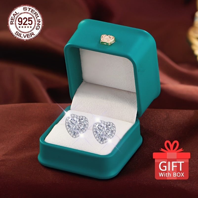 Get a pair of timeless heart-shaped synthetic zirconia stud earrings, perfect for any occasion. Made of 925 sterling silver plated material, these earrings are hypoallergenic and feature a simple round design. They come in a beautiful gift box, making