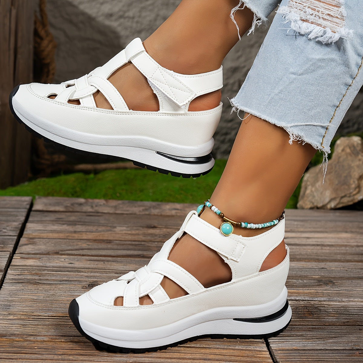 Chic white platform sandals for summer with comfortable thick sole wedge heels and easy hook-and-loop strap. Features faux cover and rubber sole for better grip.