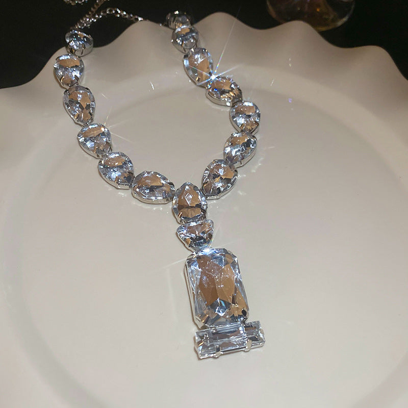 Stunning pendant necklace featuring a blend of Japanese and Korean styles, adorned with rhinestones. This iron jewelry showcases a unique rectangular and teardrop crystal design, perfect for adding a touch of elegance to parties and music festivals. A