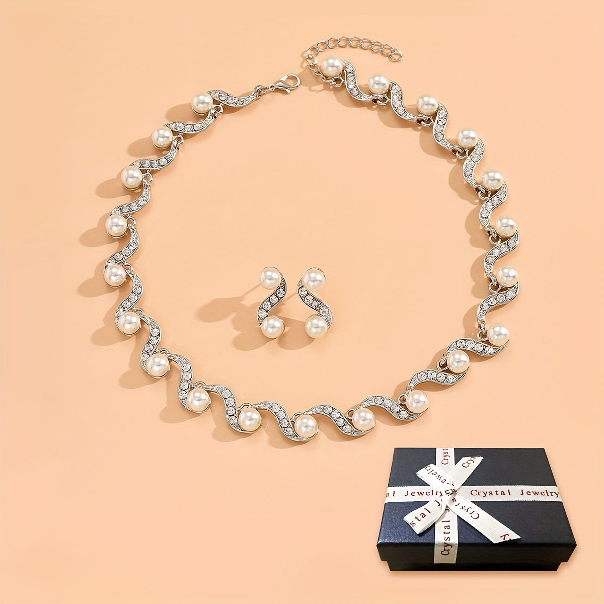 Stunning imitation pearl and diamond jewelry set, ideal for brides to wear on their special day.