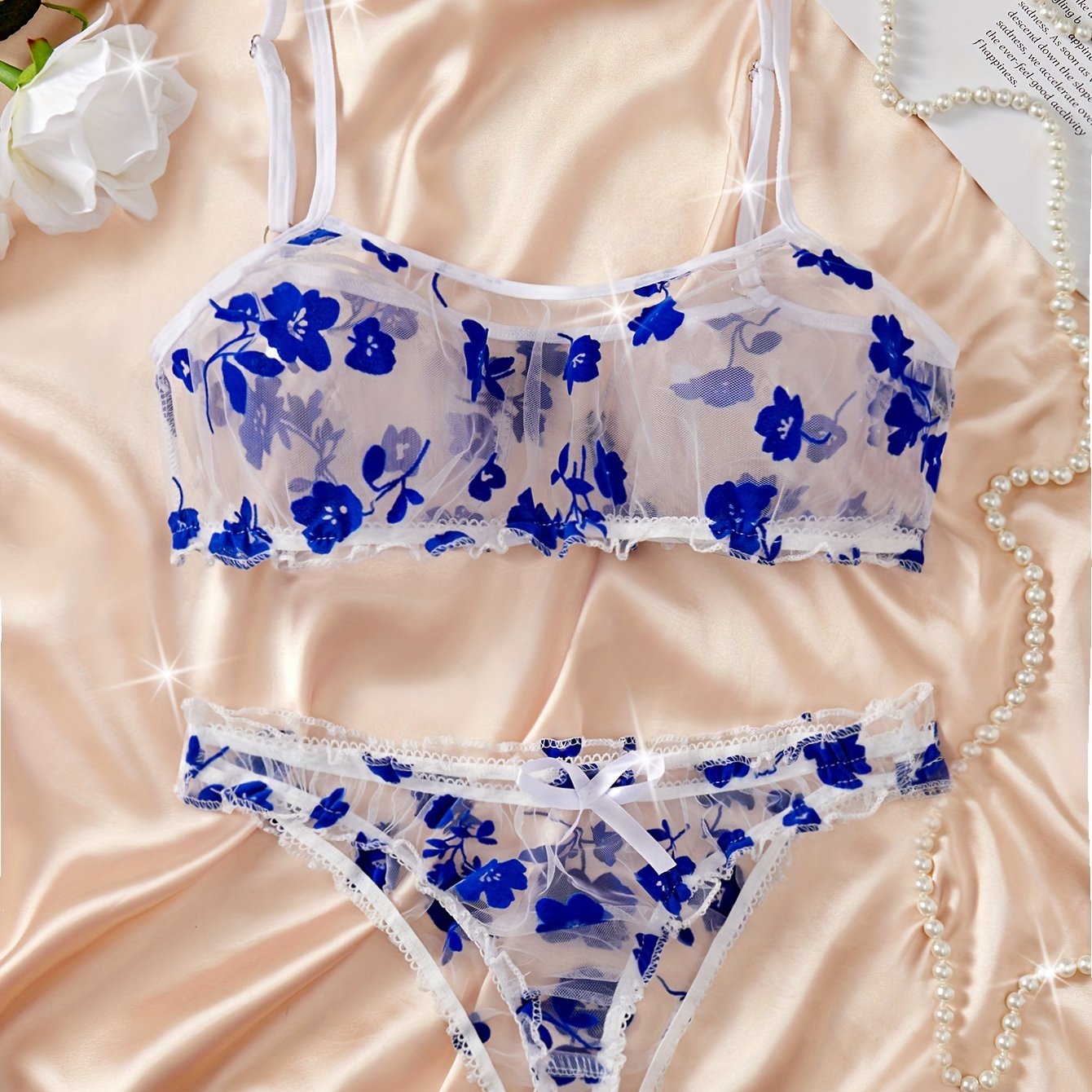 Lingerie set with floral print tulle, see-through bow bra, and tempting thong.