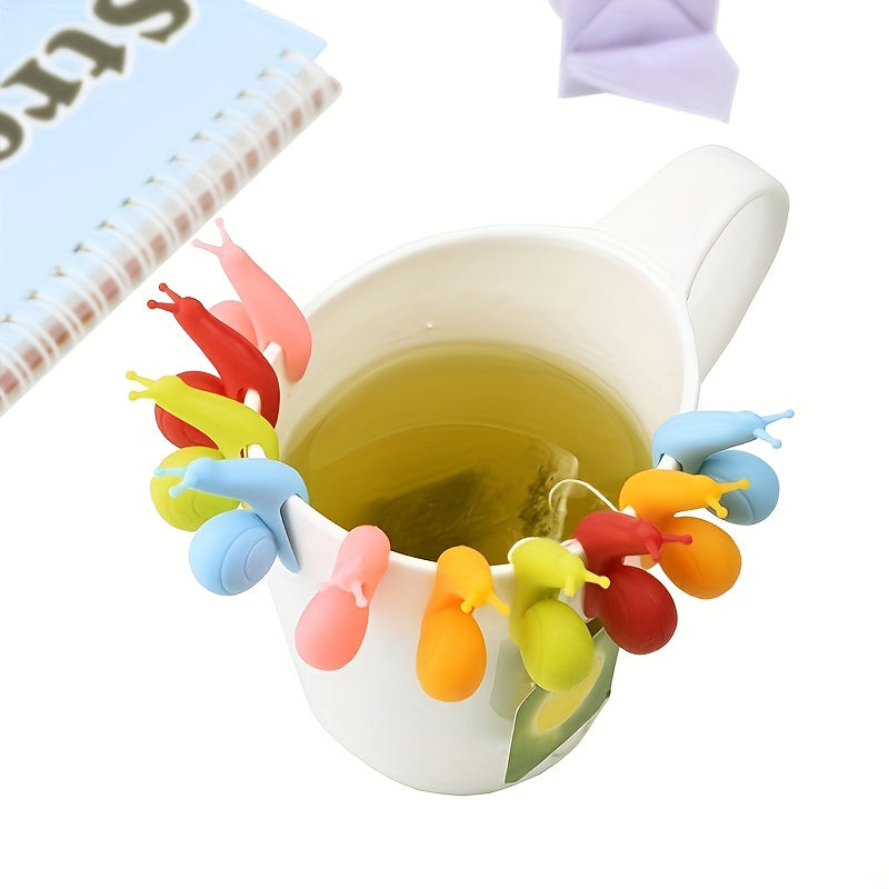 NeslGenc 10-piece set of adorable snail-shaped silicone tea bag holders, vibrant snail cup holders, snail glass labels, party supplies, handy everyday items, perfect for tea enthusiasts looking for silicone kitchen tools.