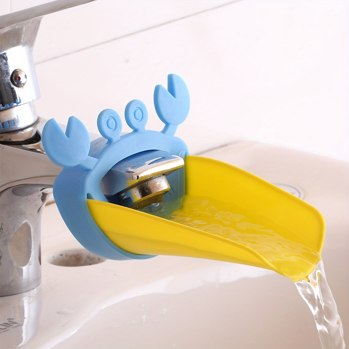 Crab-shaped water spout for kids makes hand washing fun with cartoon design.