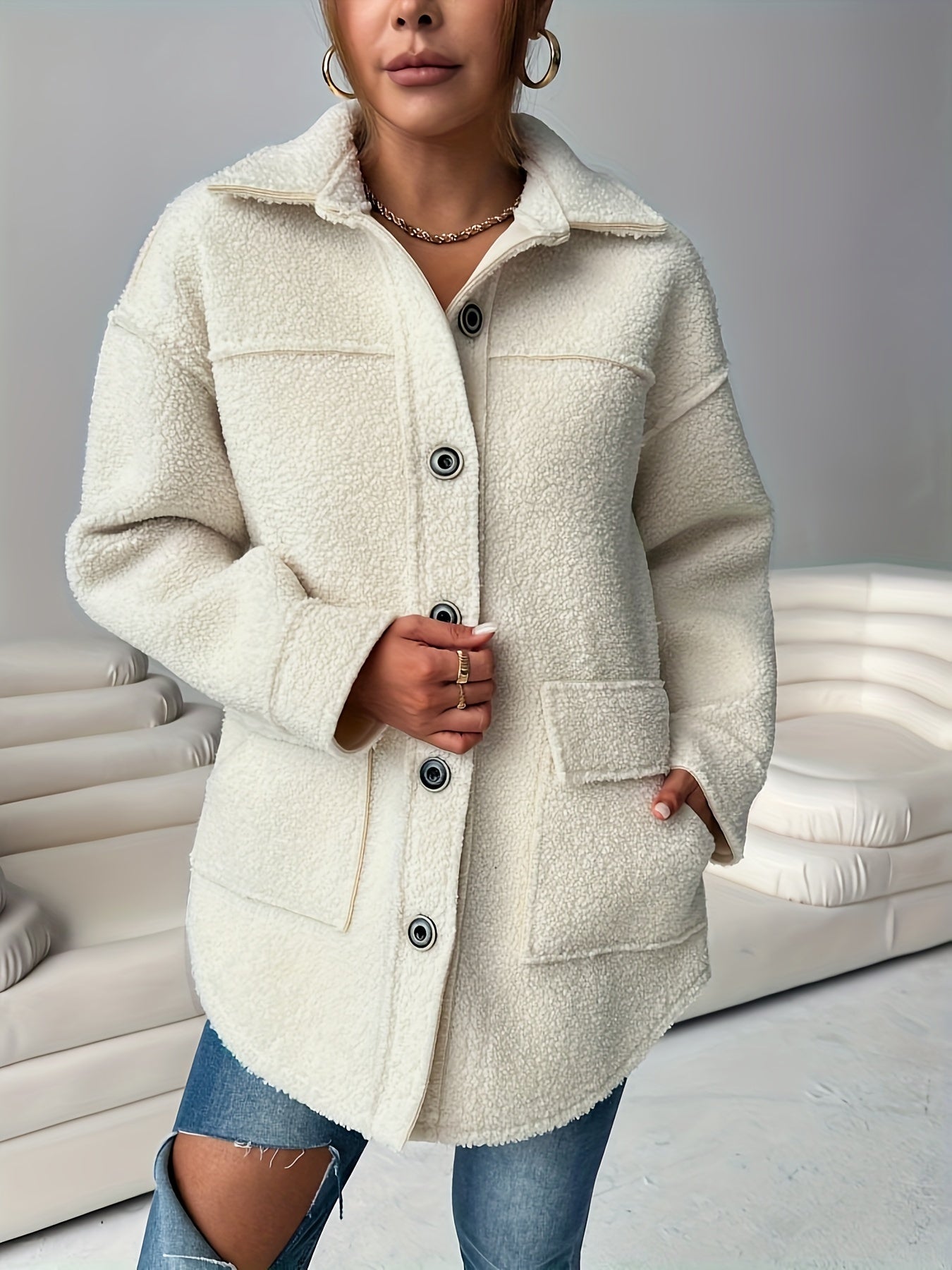 Women's casual teddy jacket made of solid color polyester knit fabric with lapel collar and button details, perfect for fall/winter.