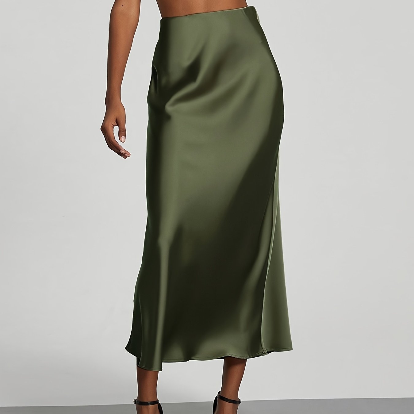 Elegant black high-waisted maxi skirt with A-line cut and smooth satin fabric, perfect for any occasion. Casual chic at its best.