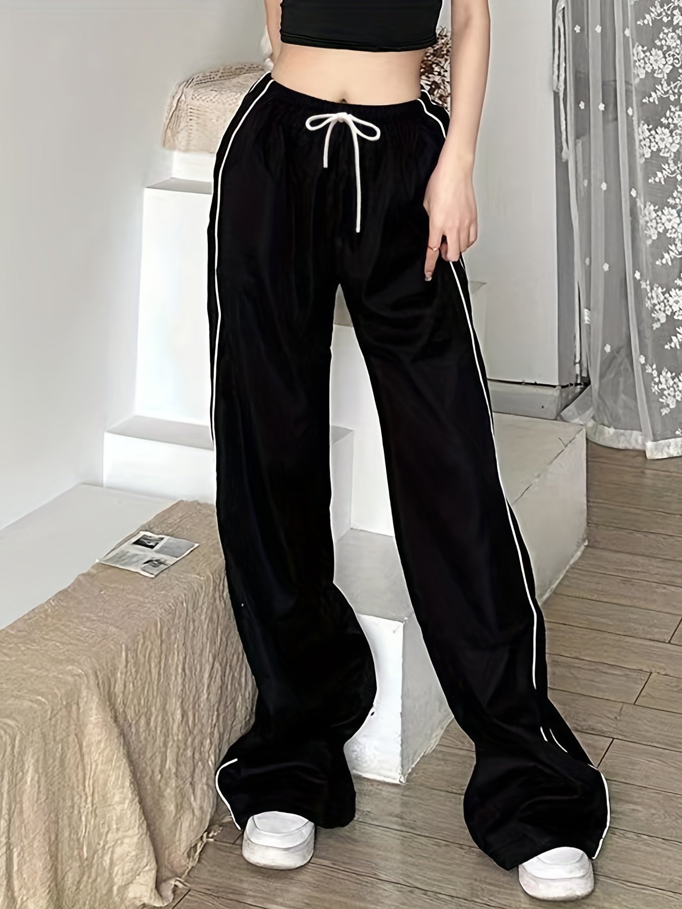 Y2K baggy pants with contrast drawstring waist and slant pockets for women.