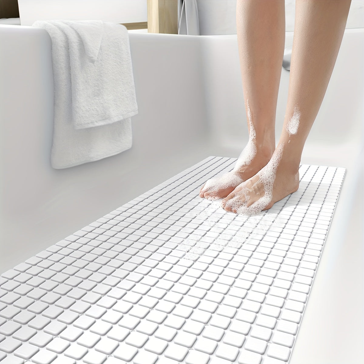 Make your shower experience safer and more comfortable with the DEXI Extra Long Non-Slip Bath Tub Mat. Measuring 39.88cm x 100.08cm, this gray PVC mat features suction cups and drainage holes for added security. Machine washable and perfect for gifting