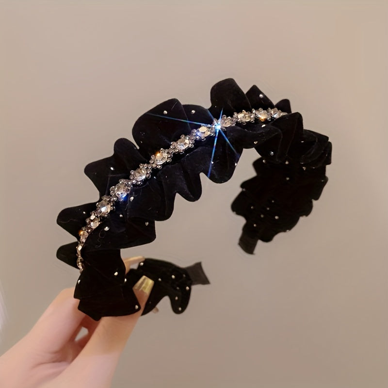 Black velvet headband with rhinestone embellishments, ideal for weddings and formal events.