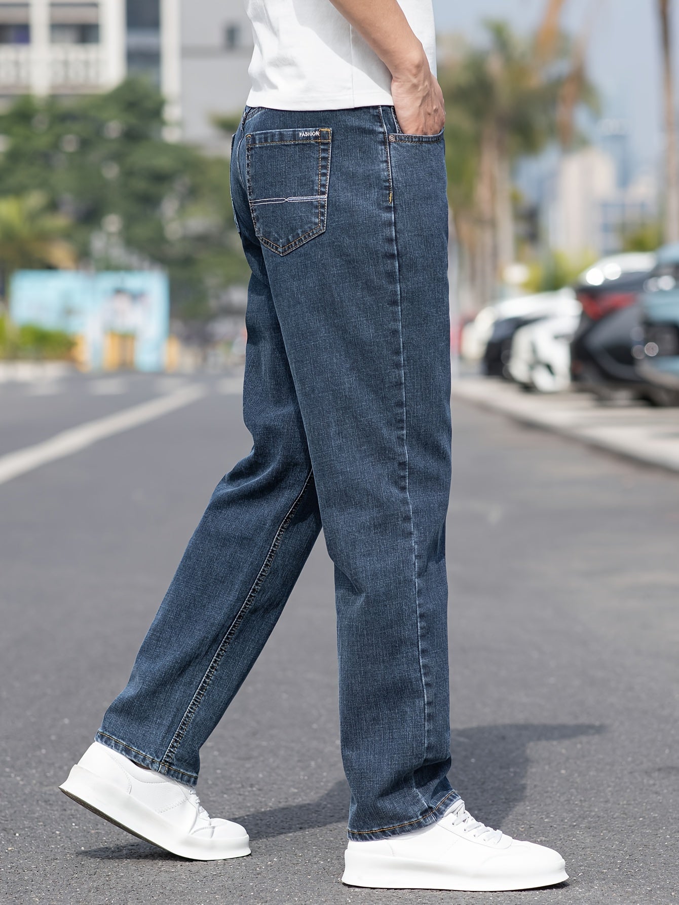 Solid loose denim trousers with pockets for men, made from breathable cotton blend. Perfect for outdoor activities.