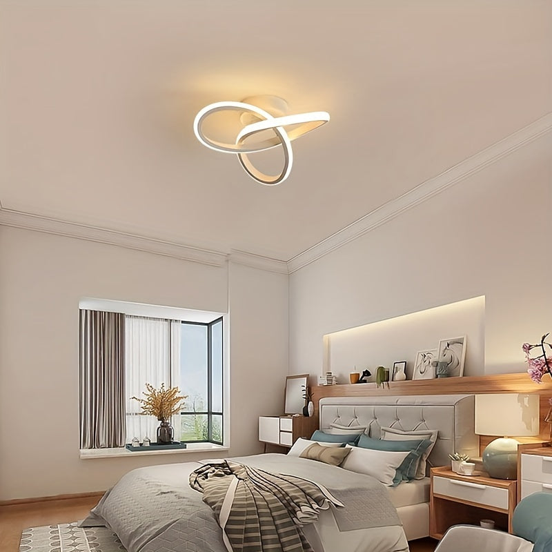 LED ceiling light fixture with modern knot design in black and white metal, providing warm ambient glow. Ideal for home and office decor, contemporary and sleek design.