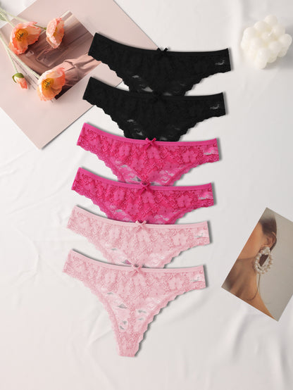 Six elegant floral lace women's thongs in black, pink, and white, with a sexy low-rise, stretch fit. Made from a breathable nylon blend with delicate lace detailing.