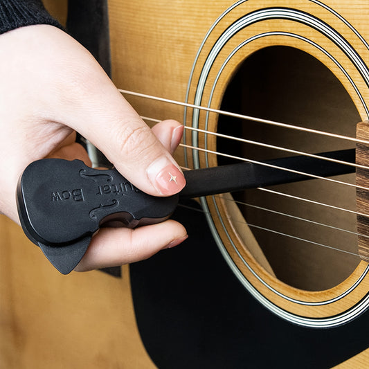 Black PP guitar bow for playing classical music on folk guitar, organ, and other musical instruments. Portable and creative picking tool.