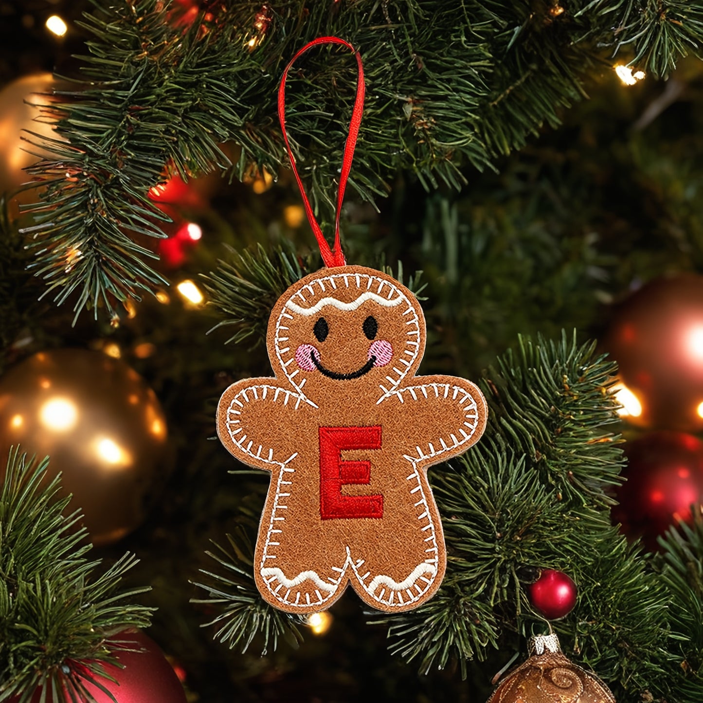 Embroidered gingerbread man ornament for Christmas decoration, made of fabric material. Classic style and no power required. Perfect for home and kitchen use.