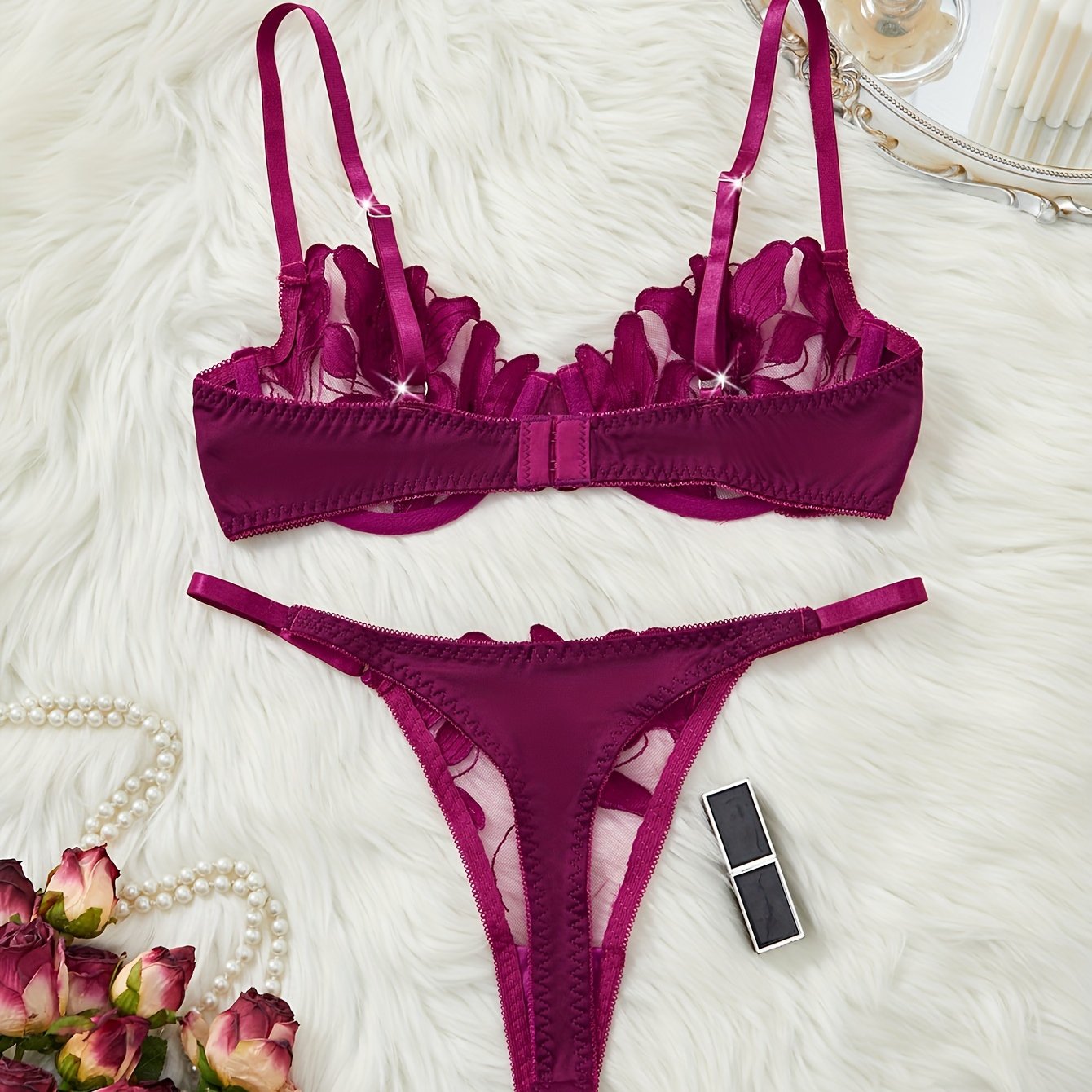 Floral embroidered cami bra and panties set for women.