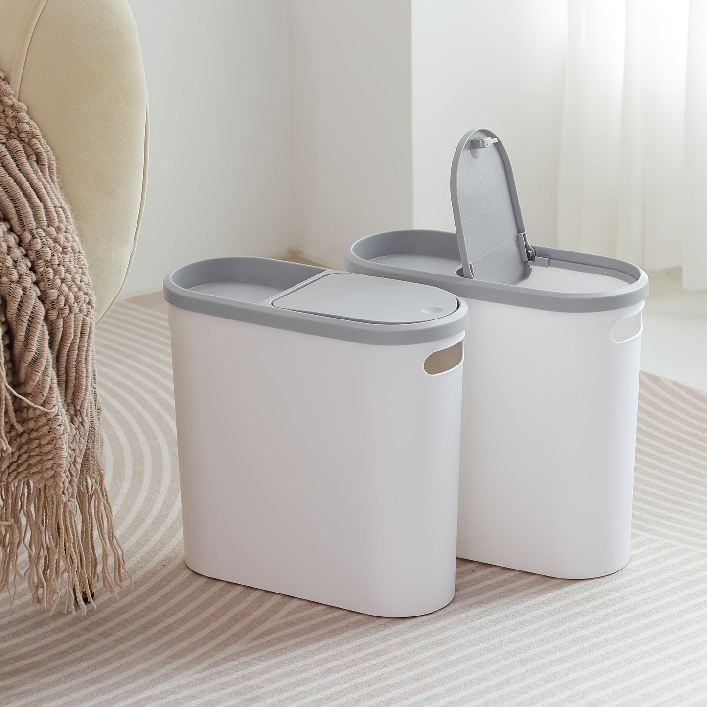 Durable plastic trash can with built-in handle for small spaces such as bathrooms, laundry rooms, and home offices.