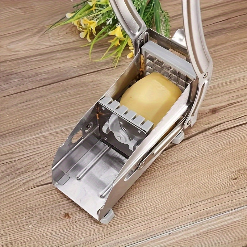 One piece of a multifunctional fruit slicer made of stainless steel, can be used as a vegetable cutter, potato shredder, onion mincer chopper, household cheese grater, vegetable grater, ginger grater, part of a collection of kitchen gadgets and tools.