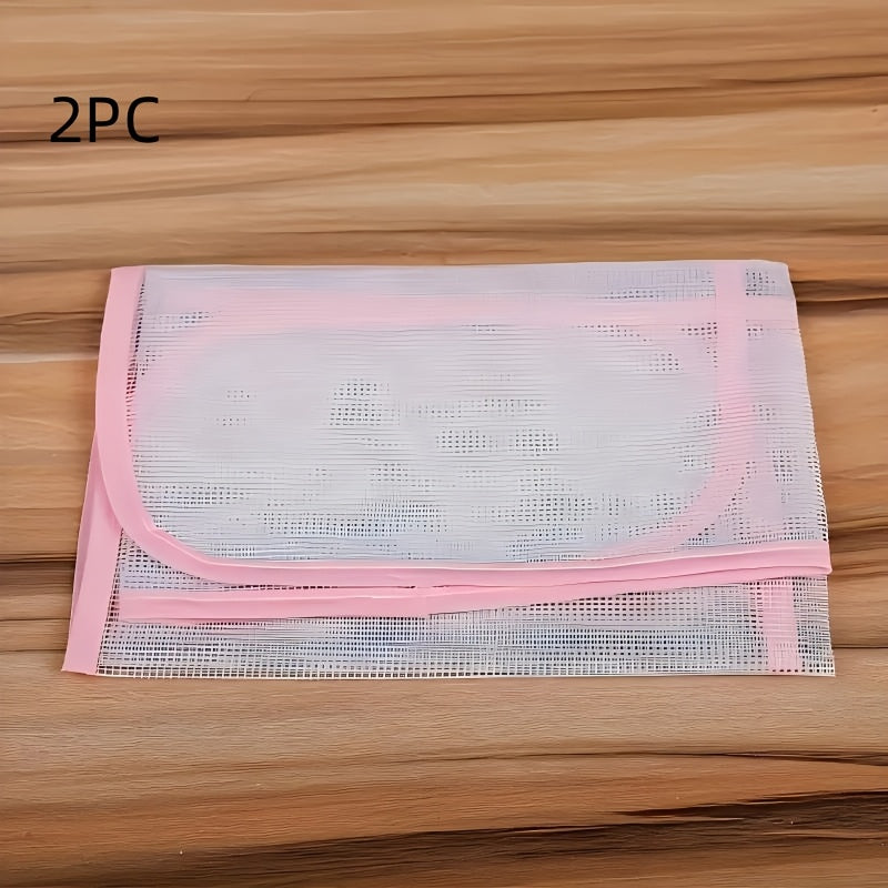 Protect your clothes and ironing board with the durable 2-Pack HeatGuard Ironing Protector Mats. These plastic steam ironing pads feature a mesh design for optimal heat distribution.