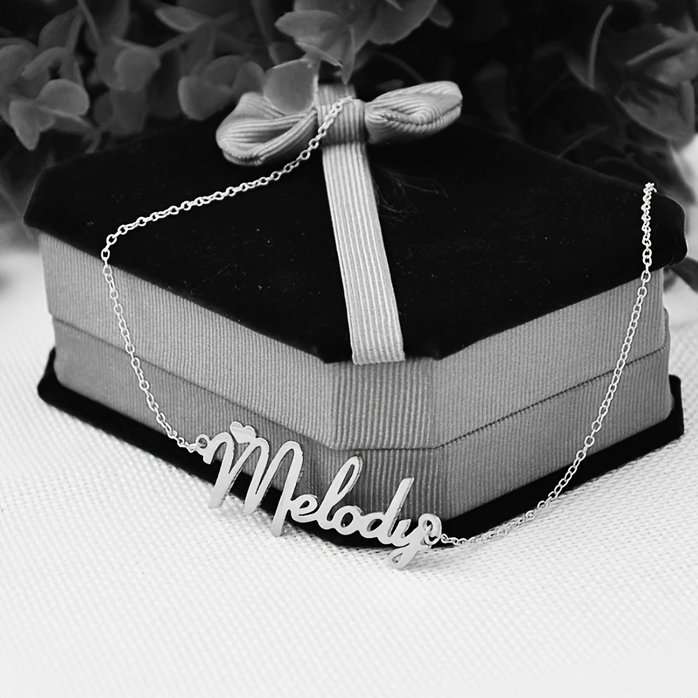 Custom name pendant necklace made of elegant boho stainless steel with a heart charm. Perfect for personalized bridesmaid jewelry, ideal for parties and gift-giving. This all-season accessory also makes for a great Christmas gift.