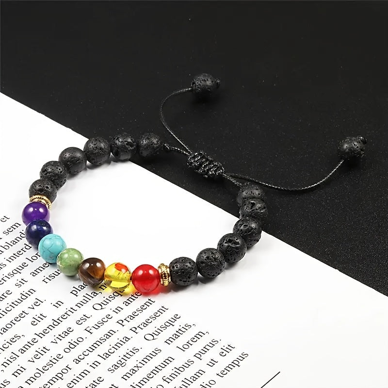 Adjustable stretch bracelet made of natural lava rock beads with 7 chakras healing properties, featuring a simple tribal style. Perfect for daily wear or special occasions to promote balance and meditation.