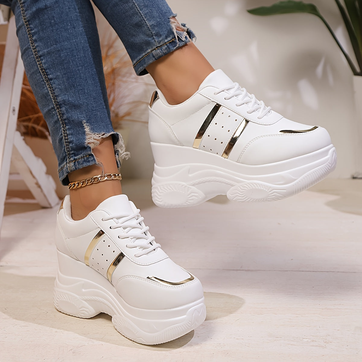 Gold-trimmed lace-up height-increasing casual sports shoes for women.