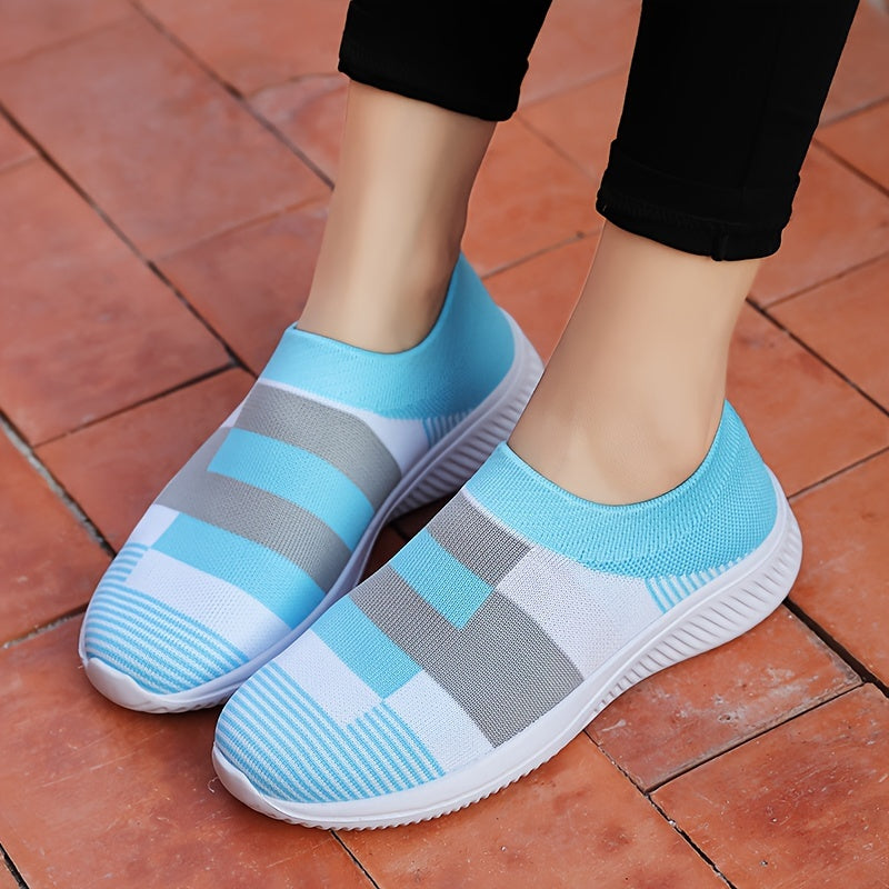 Breathable mesh slip-on sneakers for plus size women in pink, gray, and white plaid with soft sole and round toe design, suitable for all seasons.