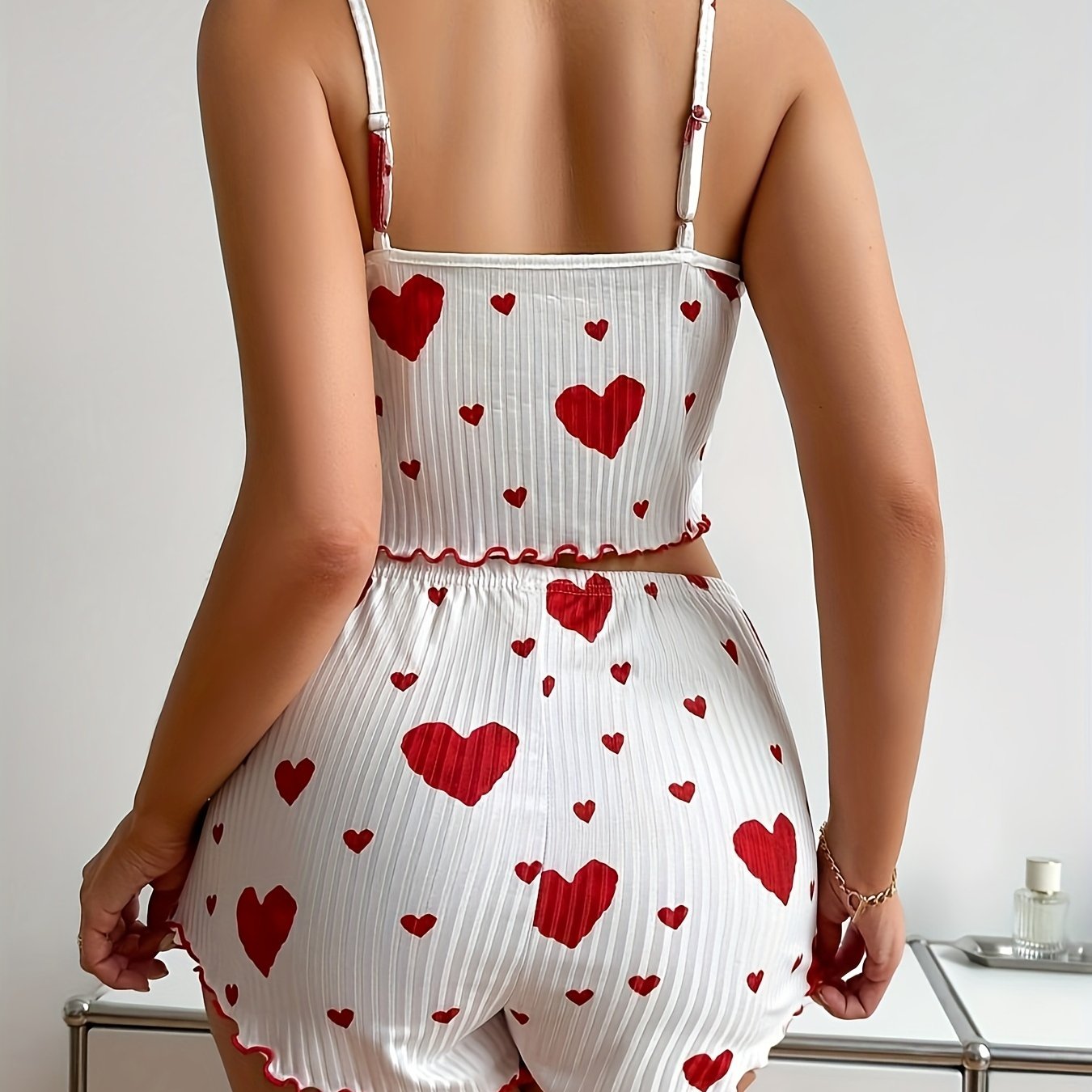 Polyester pajama set with heart print and bow detail - comfortable knit fabric for adults.