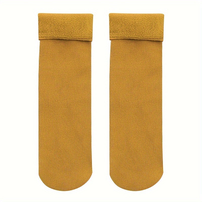 4 pairs of cozy thermal snow socks perfect for winter, lined with fleece for extra warmth, great for casual wear.