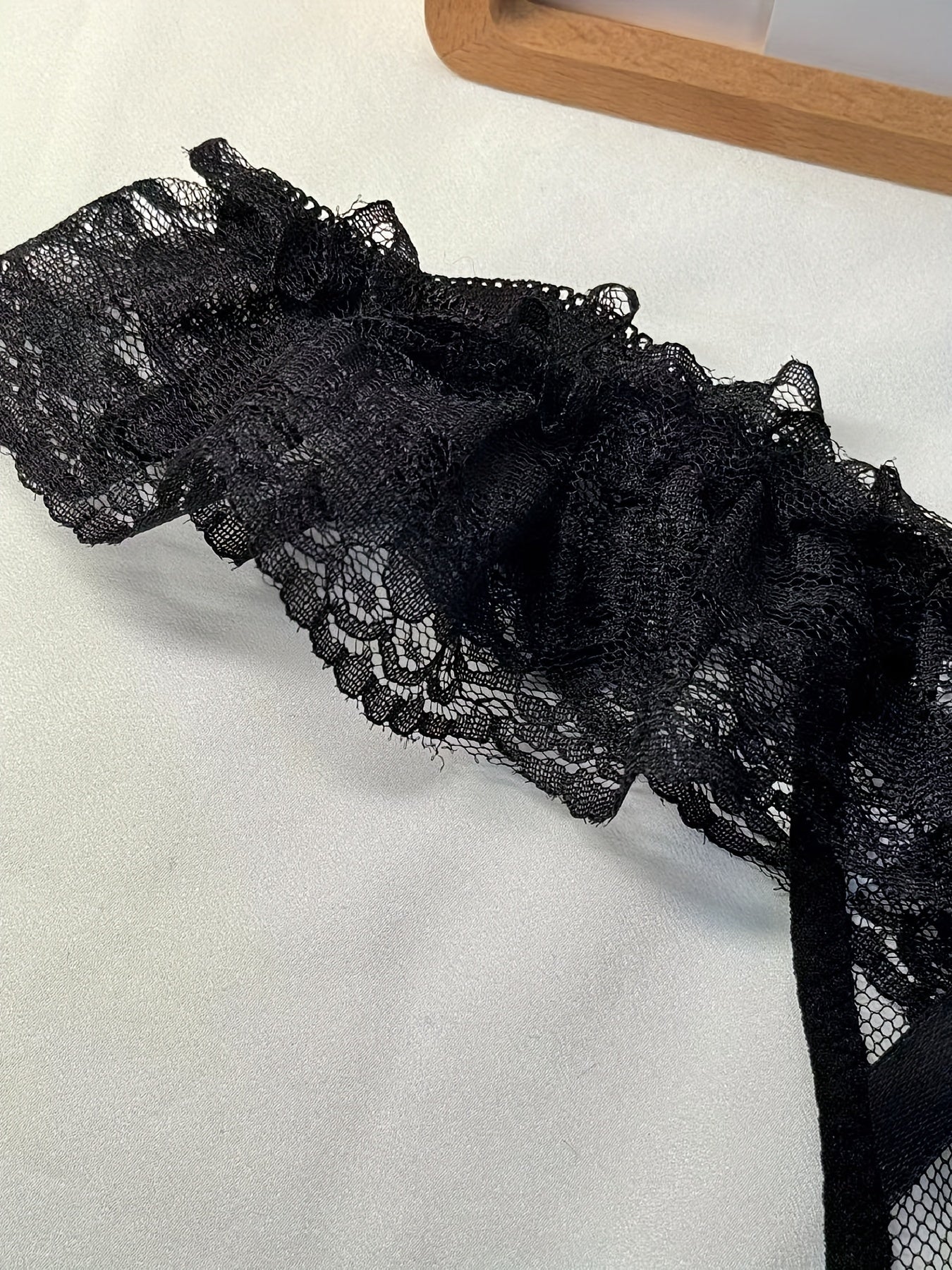 Double-bow, sexy, transparent, hot, lace crotchless thong with pearl massage detail.