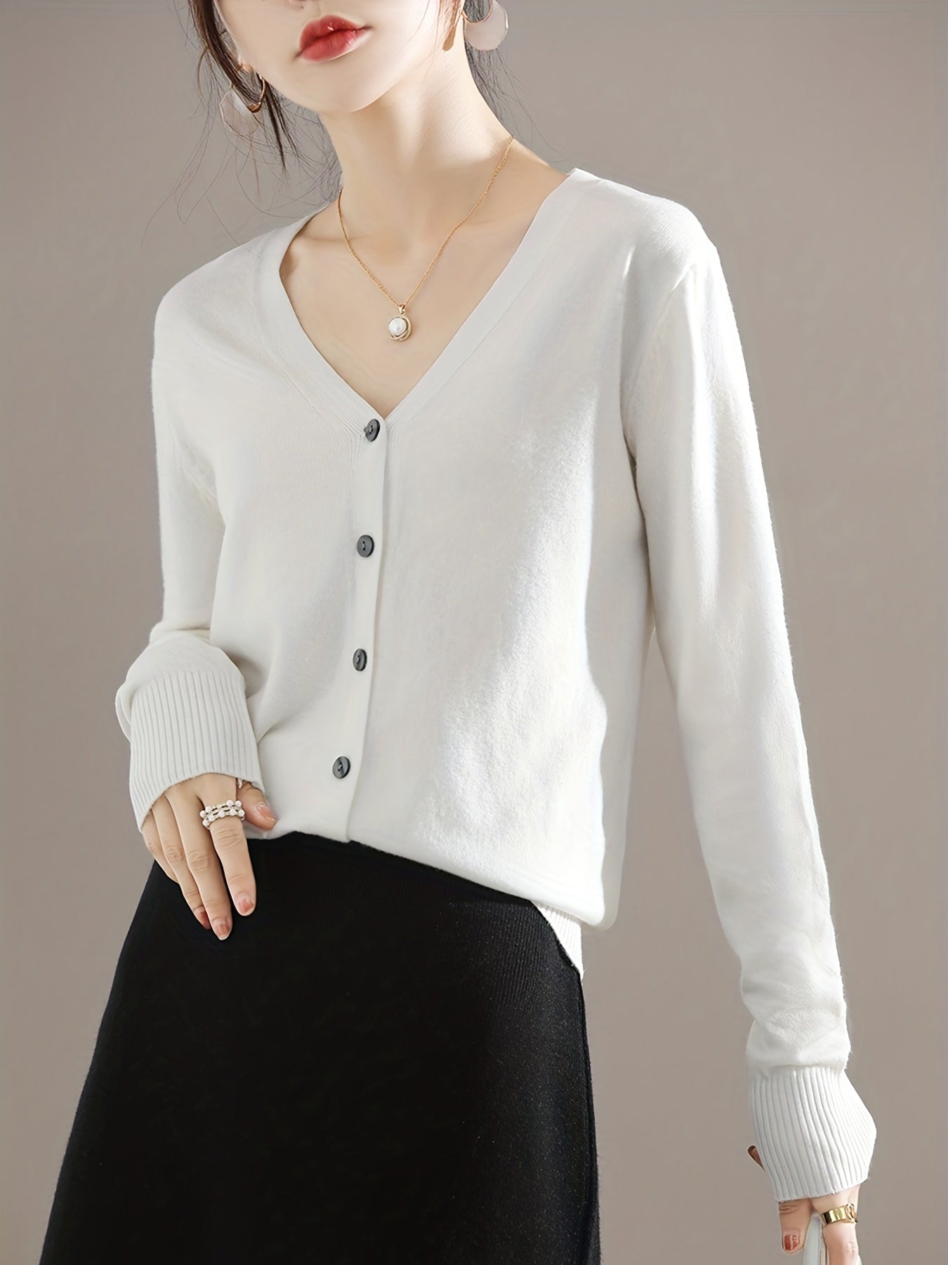 Chic V-neck cardigan with long sleeves, perfect for spring and fall.