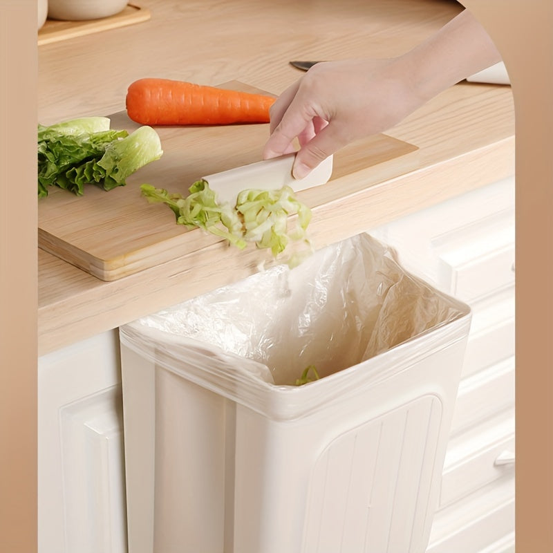 Thickened, foldable kitchen trash can hangs inside cabinet for storage without bending.