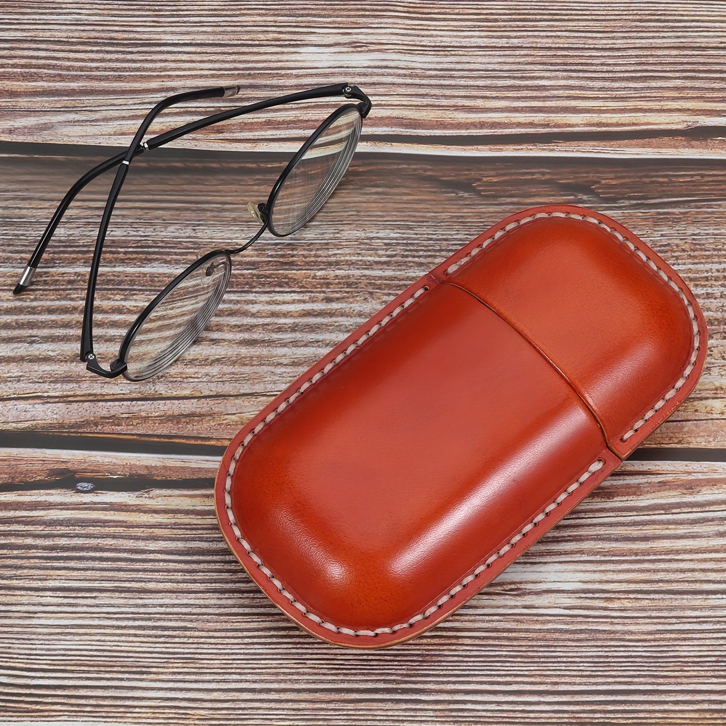 High-quality, stylish faux leather glasses case with retro-inspired design for ultimate protection and storage for your glasses.