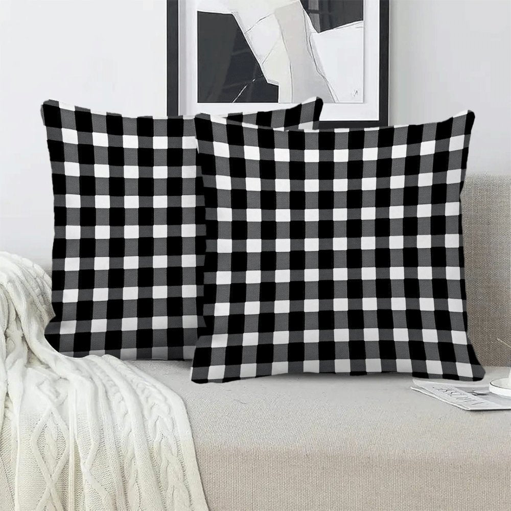 Two-pack of contemporary black and white checkered flannel pillow covers measuring 45.72x45.72 cm. These machine washable, zippered square cushion cases are perfect for use on your sofa, bed, or outdoor furniture in any season. Please note that pillow