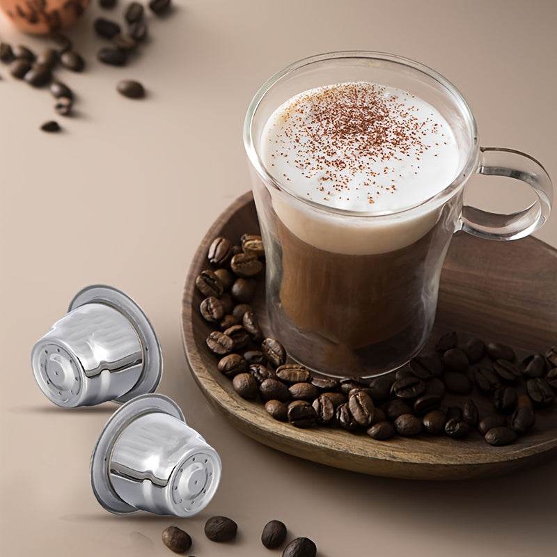 Reusable stainless steel Nespresso coffee capsule for home baristas, designed with a conical shape and flat bottom for improved brewing. Made with high-quality materials for a refillable and environmentally friendly option.