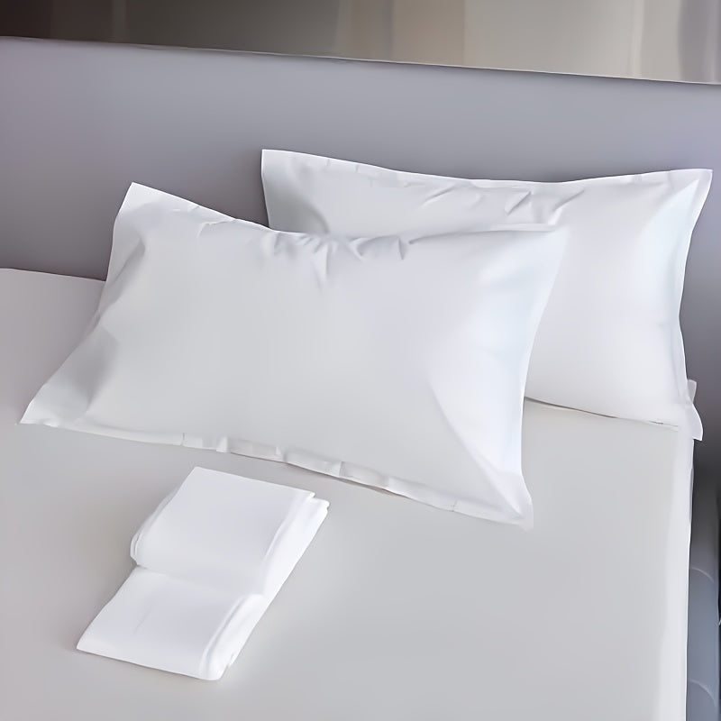 Two-pack of contemporary white disposable pillowcases made from tear-resistant non-woven fabric. These pillowcases are breathable and dust-free, making them ideal for use in hotels, beauty salons, and at home. Please line dry only.