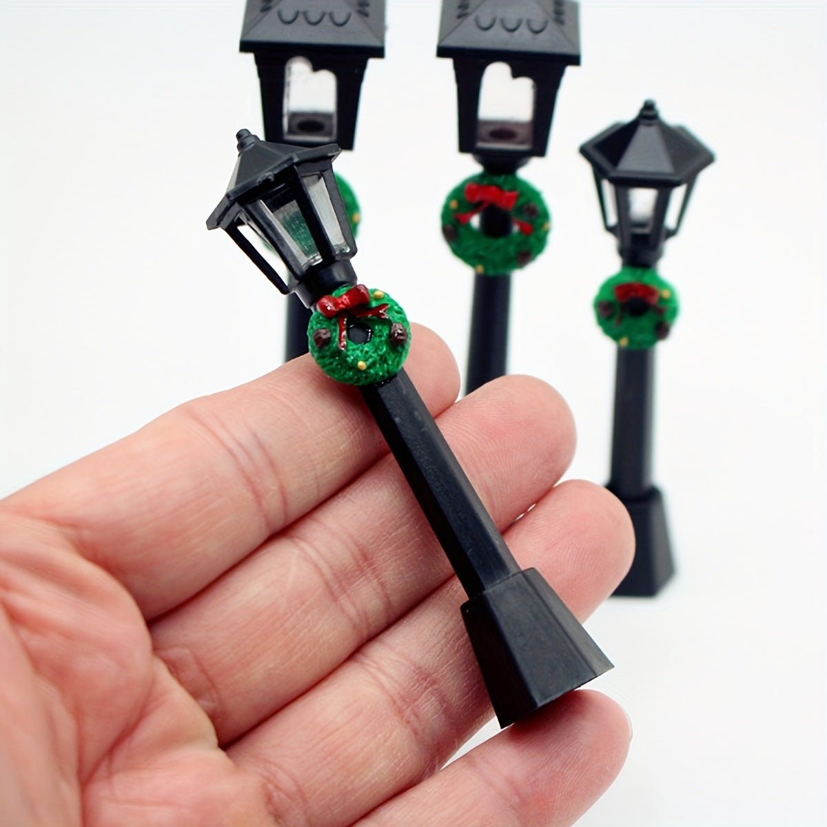 3 Miniature Christmas Lamp Posts with Wreaths, Collectible Seasonal Figurines, Plastic Material, No Electricity Needed