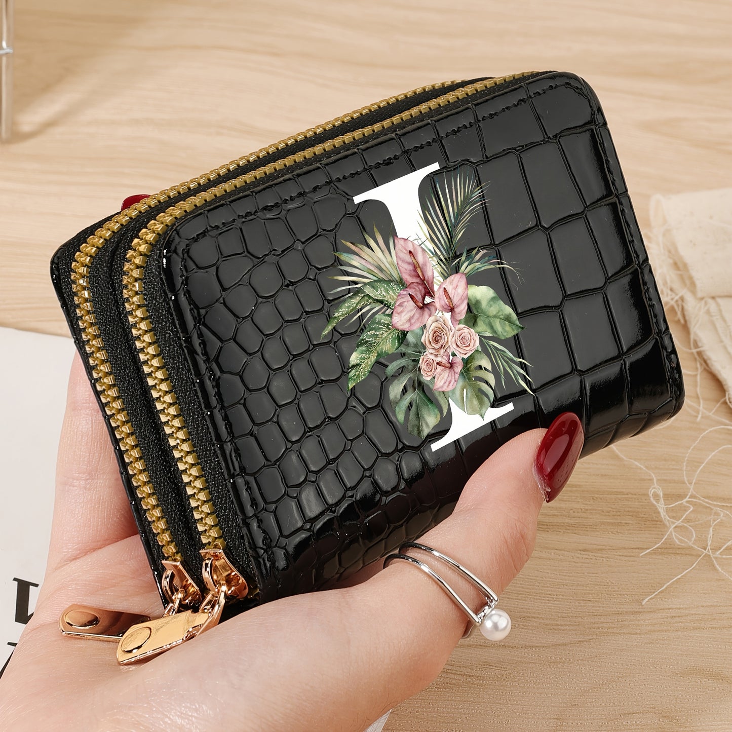 Women's credit card wallet with elegant floral letter print in black & white. Features large capacity, dual zipper, crocodile texture PU, lightweight design with nylon lining for everyday