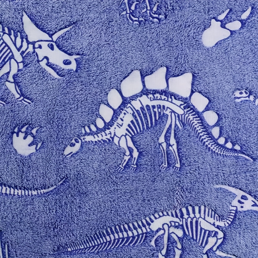 The perfect gift for dinosaur enthusiasts - a cozy blue luminous polyester throw blanket that glows in the dark.