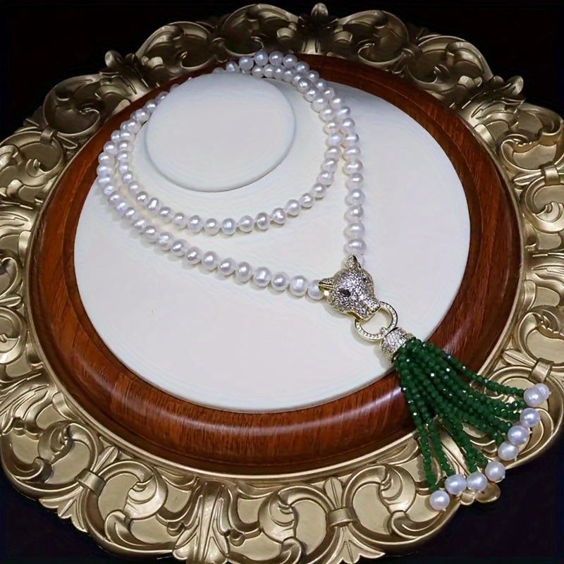 A classic Y-necklace featuring freshwater pearls and a stylish leopard clasp - perfect for adding a touch of elegance to any outfit. This versatile piece is great for weddings, banquets, music festivals, vacations, and the autumn season. It also makes a