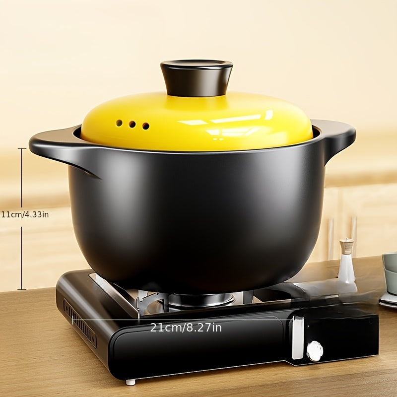 A versatile 5-liter black ceramic stockpot featuring a vibrant yellow lid - perfect for preparing stews, soups, and pot roasts at high temperatures. This multi-functional, heat-resistant, non-stick stockpot is suitable for use on open fires and electric