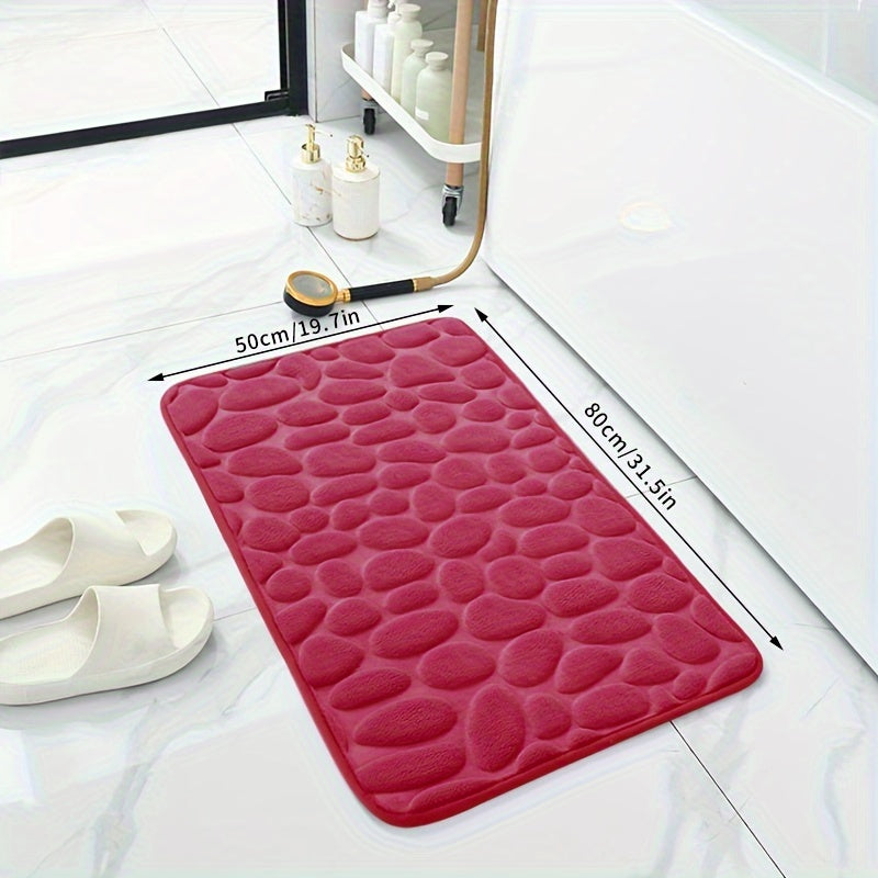 Soft, non-slip coral fleece bathroom mat in a pebble pattern. Quick-dry, machine washable, and low pile for comfort and home decor. Made of plush polyester fiber with knit fabric and 100% polyester material. 570gsm and 1.4cm thick.