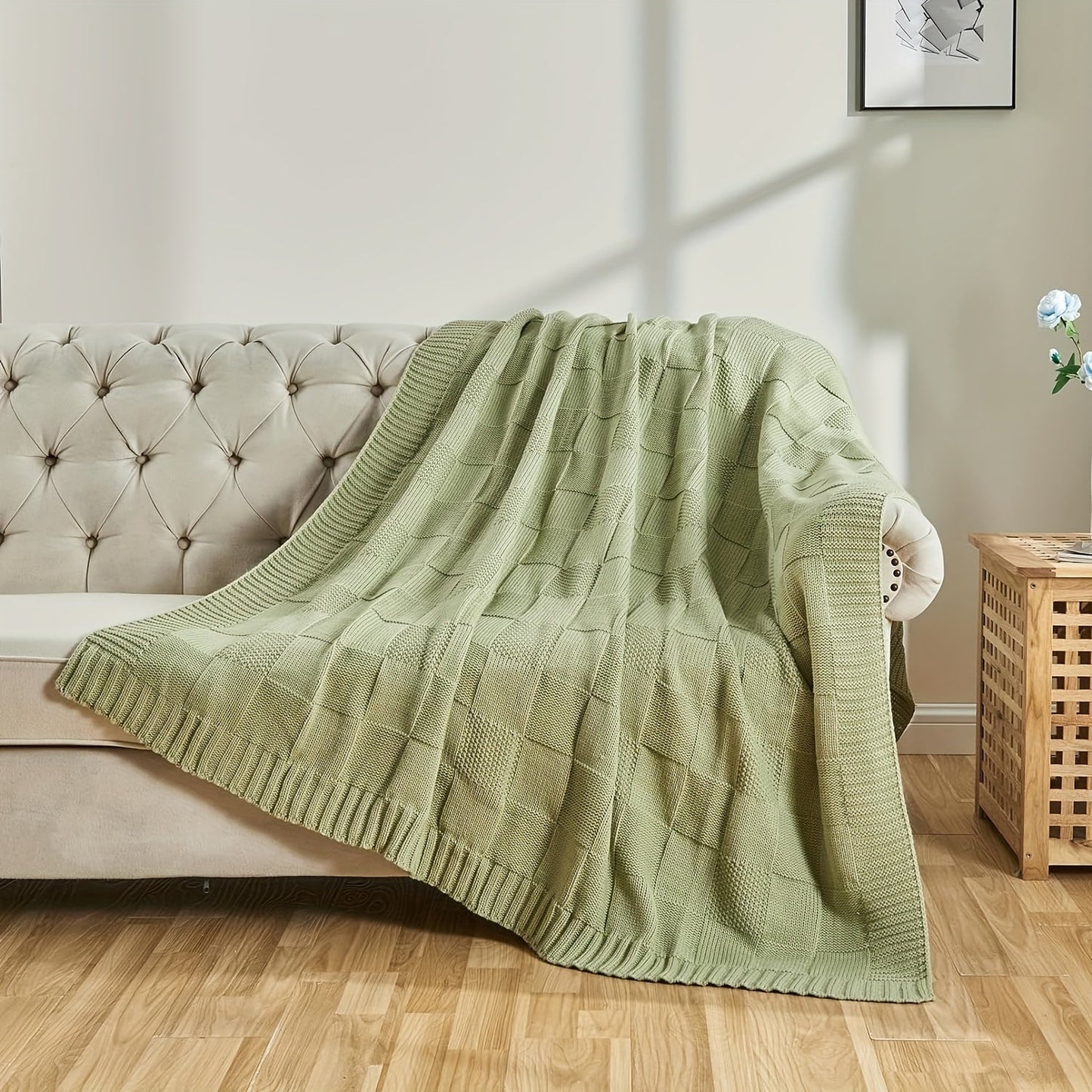 Soft and cozy knit throw blanket in white checkered pattern, perfect for couch or bed. Keep warm and stylish in any room with this knitted throw blanket.