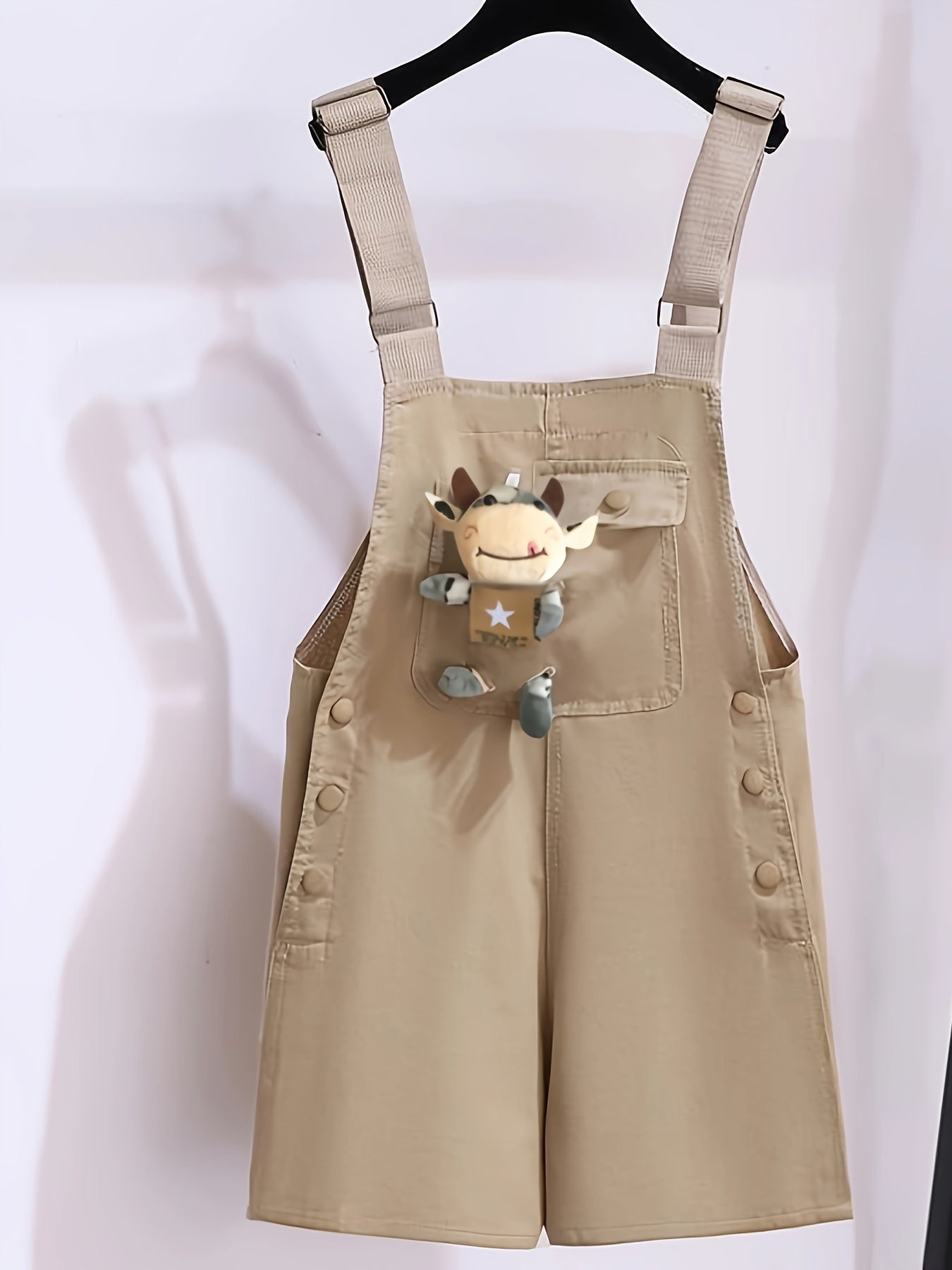 Girls' summer outfit with trendy suspenders and lightweight overalls for outdoor wear.