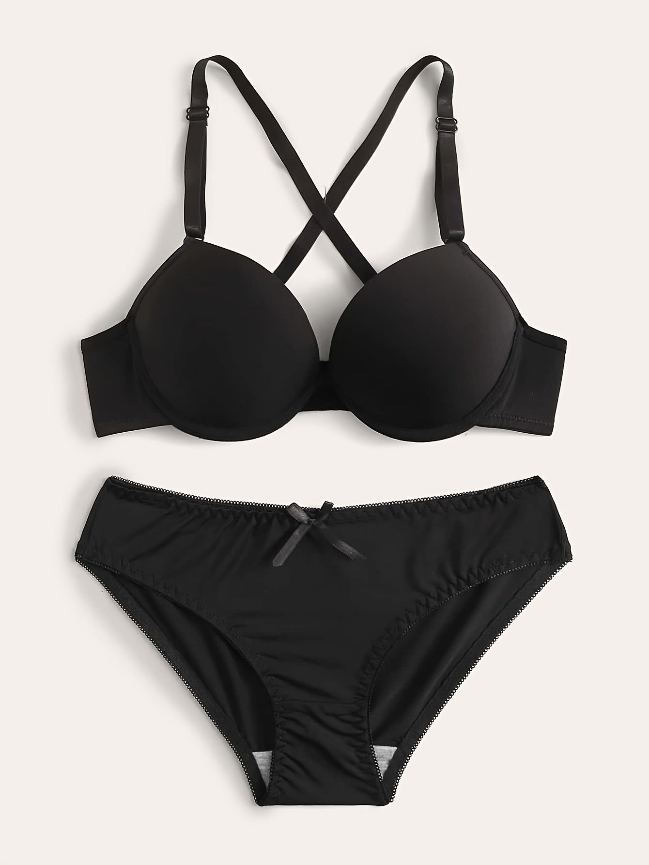 Push-up lingerie set for women, with underwire bra and high-waist panties. Nylon blend, available in black, white, and red.