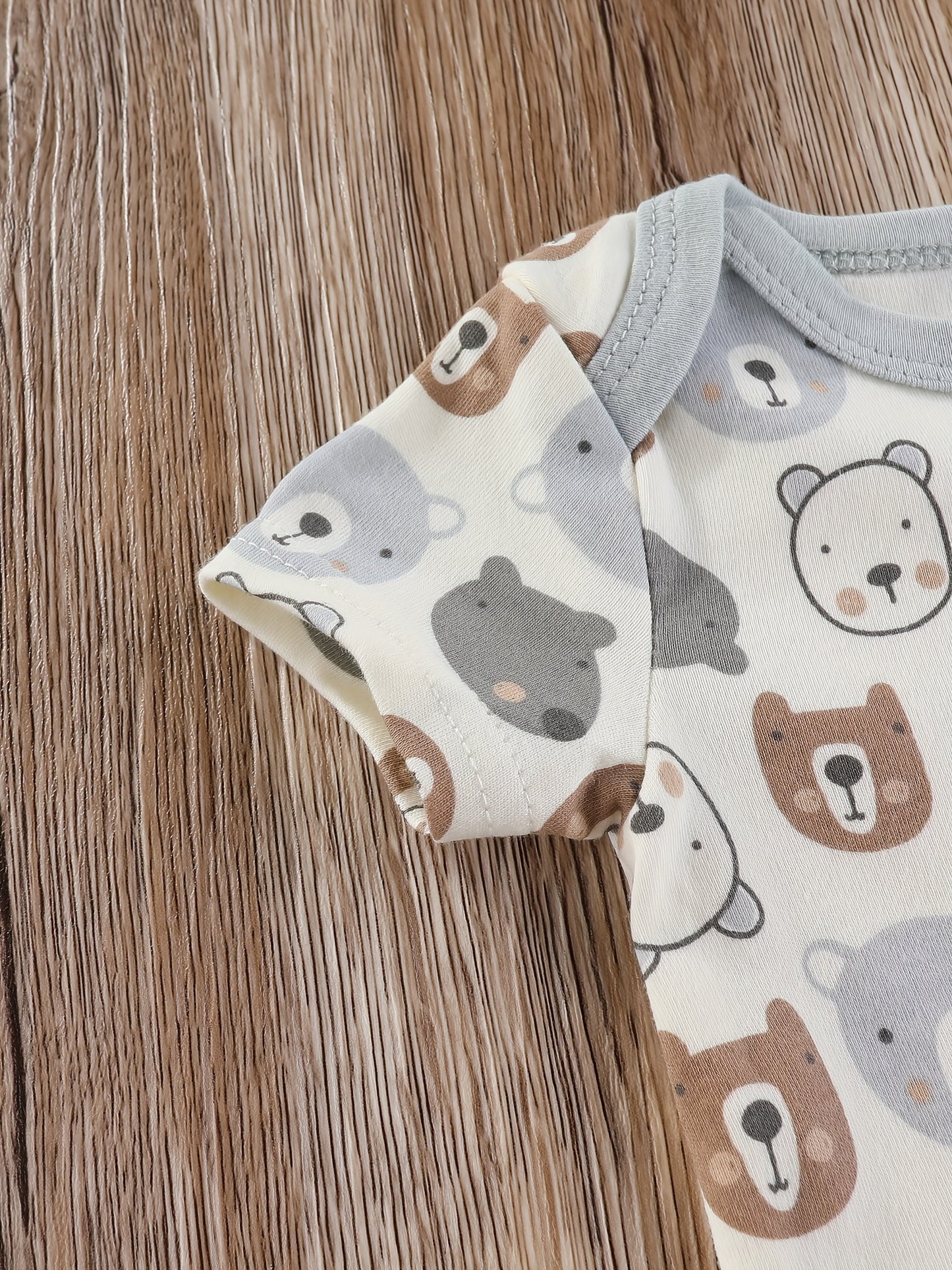 Baby boy's short sleeved cotton jumpsuit featuring plain color, stripes, bear embroidery, and bear heads print. Soft, breathable, and perfect for summer daily and outdoor wear.